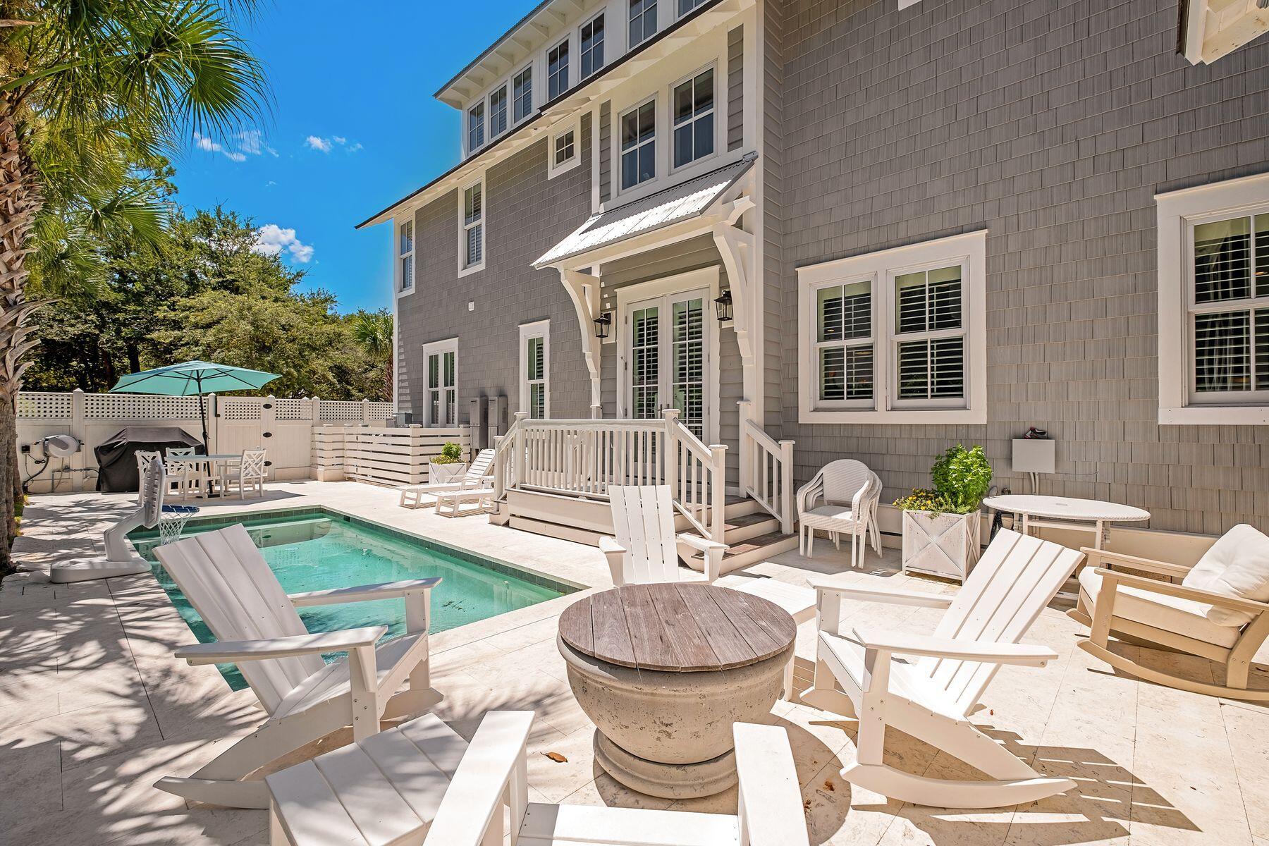 13 Madaket Way Watersound, FL 32461 - Photo 2 of 51 a view of a patio with couches table and chairs and potted plants