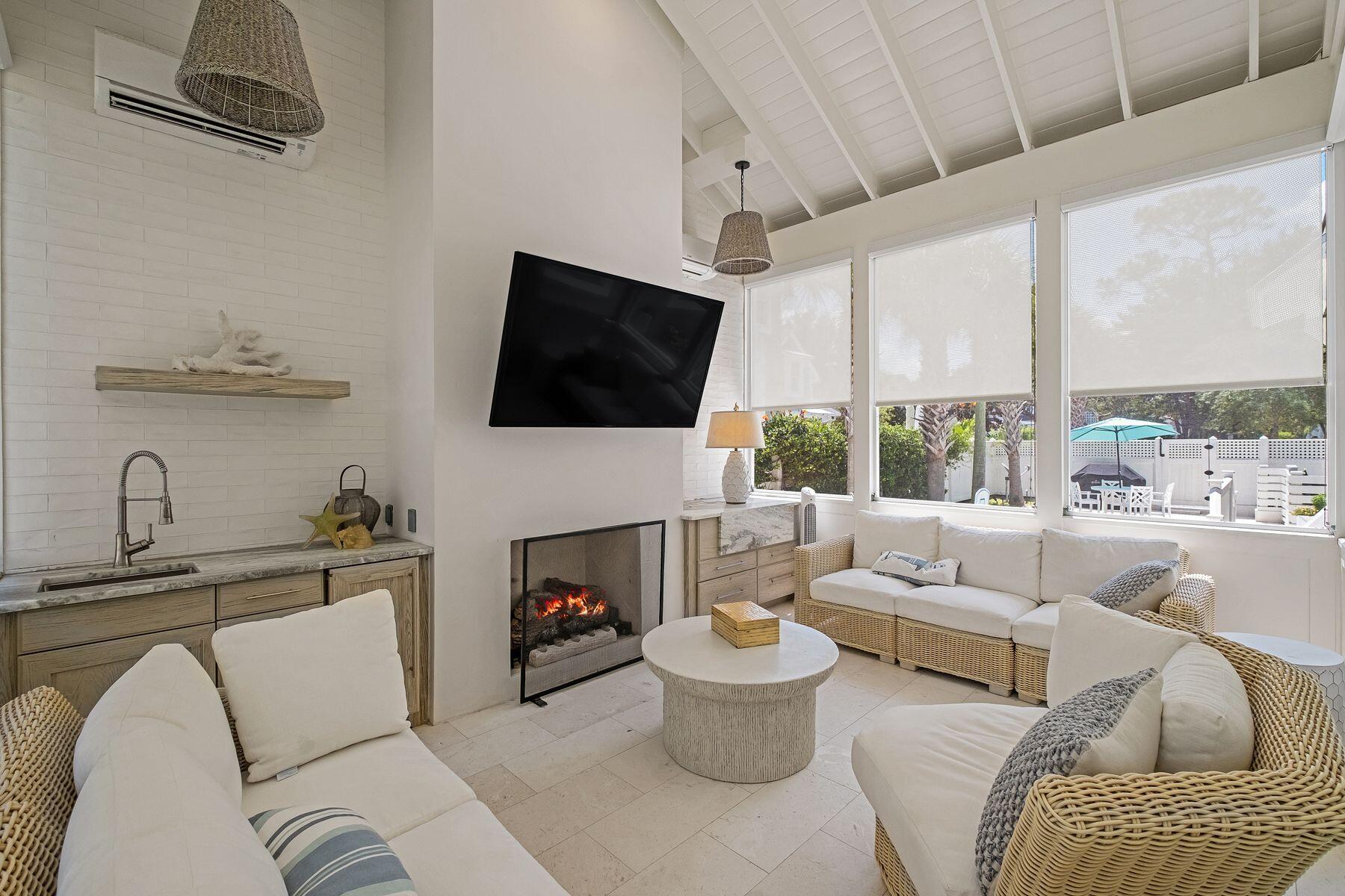 13 Madaket Way Watersound, FL 32461 - Photo 3 of 51 a living room with furniture a fireplace and a flat screen tv