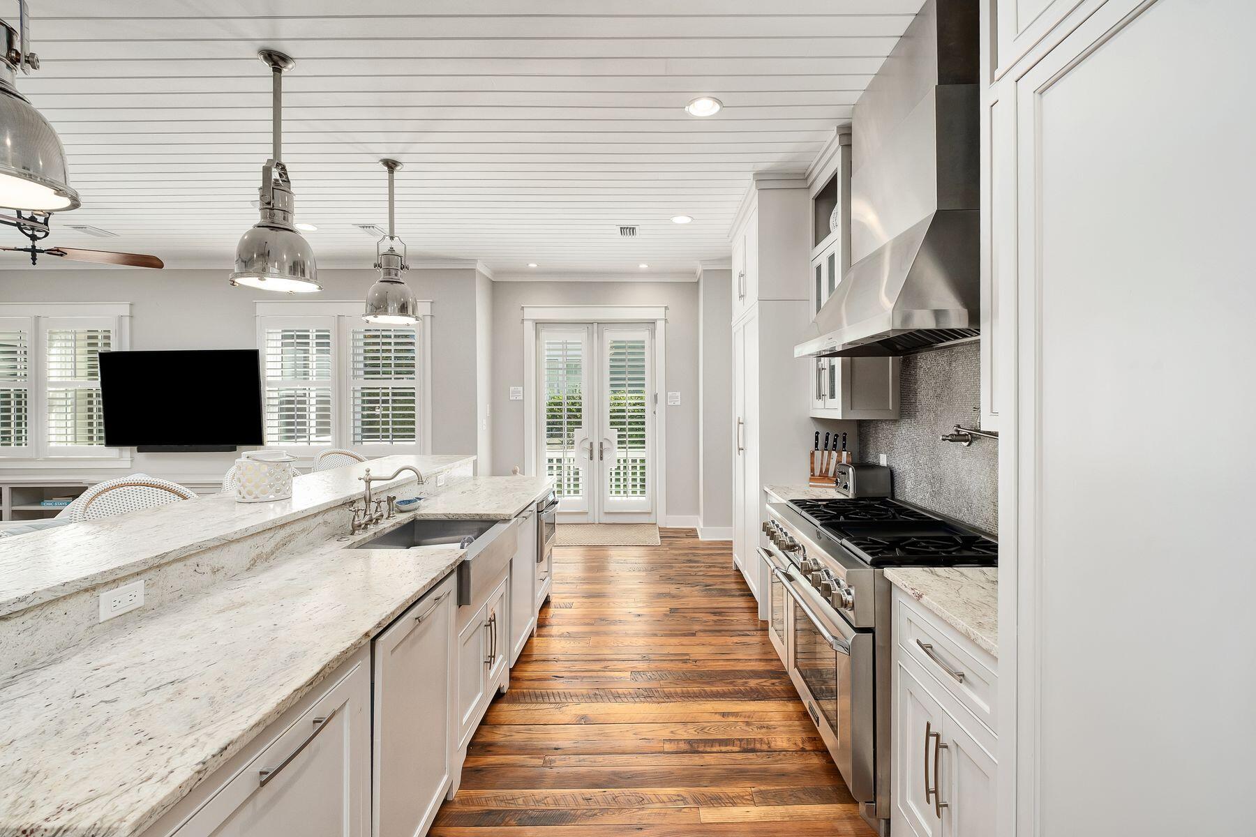 13 Madaket Way Watersound, FL 32461 - Photo 10 of 51 a view of a kitchen with kitchen island granite countertop a sink and a stove