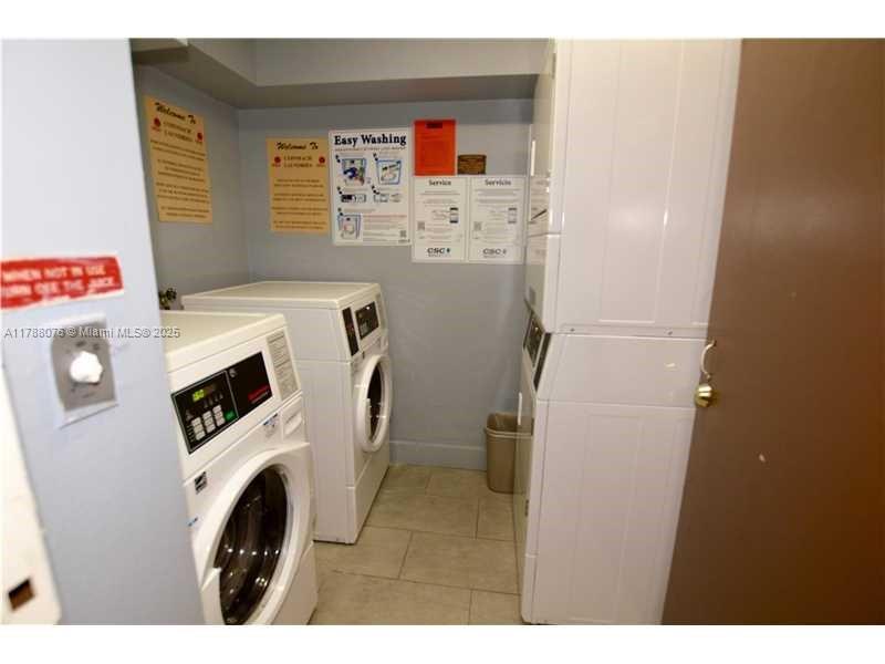 494 Northwest 165th Street, Unit C102 Miami, FL 33169 - Photo 14 of 14 a utility room with dryer and washer