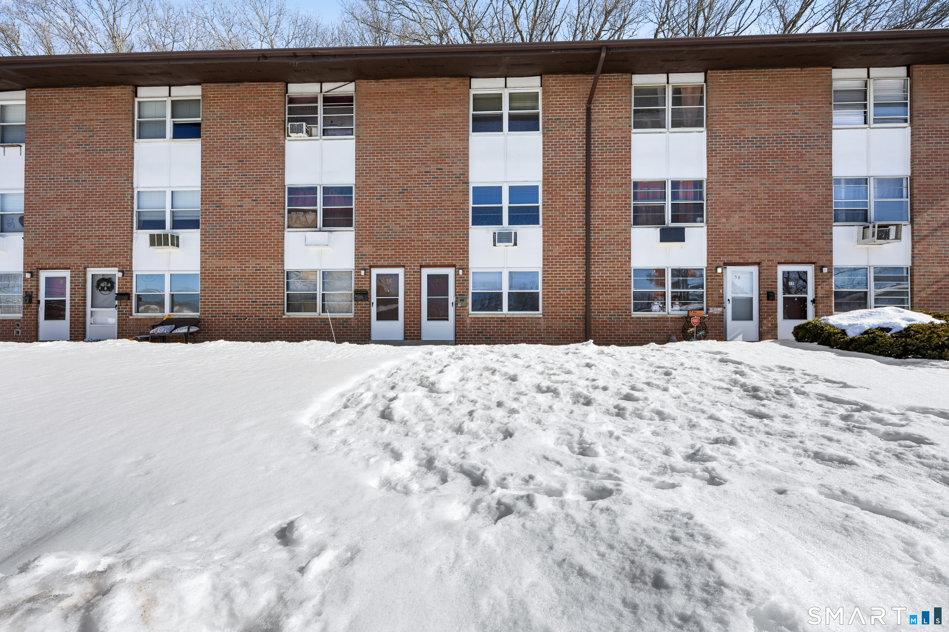 a view of a building with a snow on the road