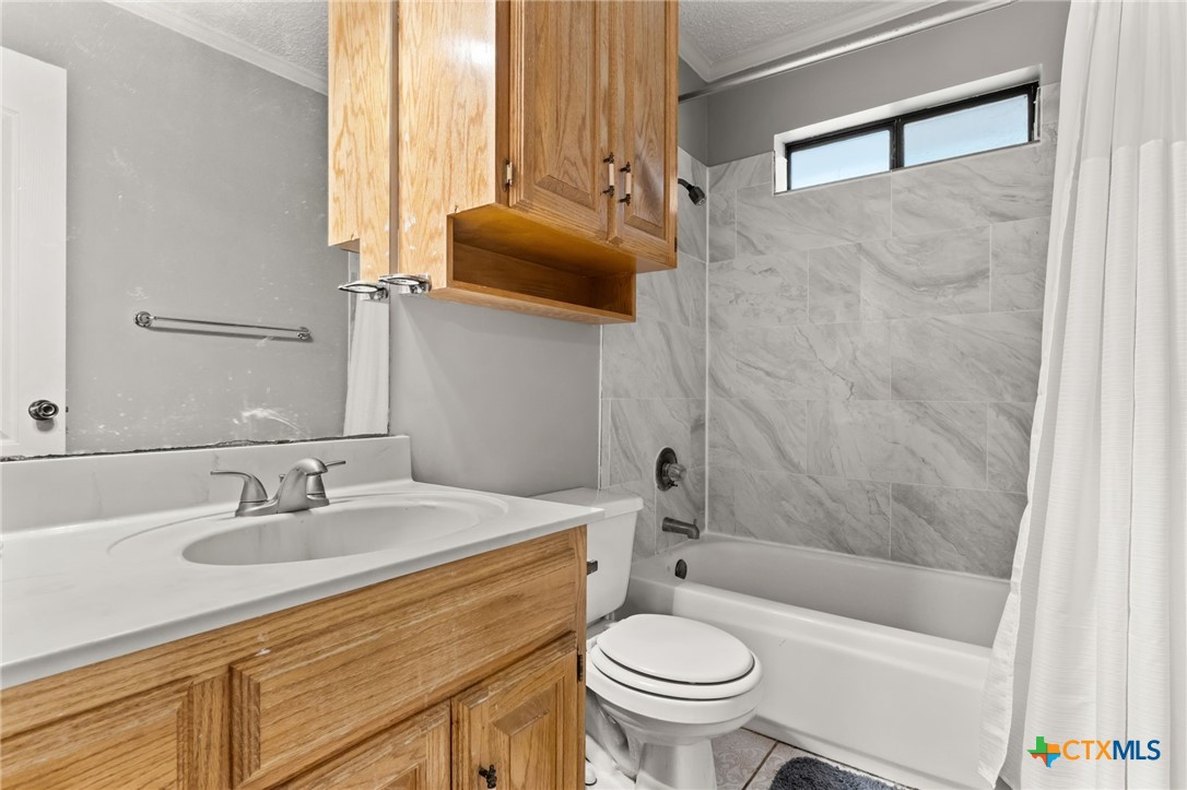 2187 Stagecoach Road Killeen, TX 76542 - Photo 16 of 27 a bathroom with a sink toilet and shower