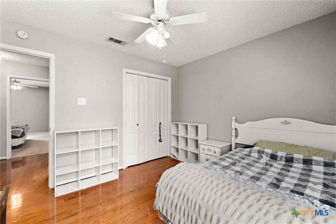 2187 Stagecoach Road Killeen, TX 76542 - Photo 18 of 27 a bedroom with a bed and cabinets