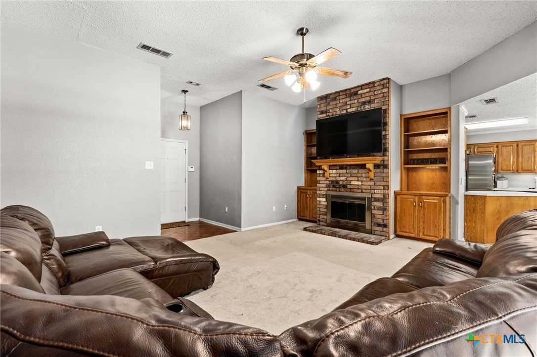 2187 Stagecoach Road Killeen, TX 76542 - Photo 6 of 27 a living room with furniture and a flat screen tv