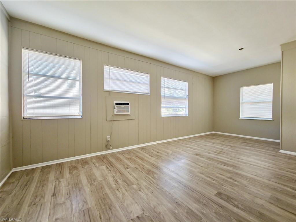 3488 Roberts Street Mims, FL 32754 - Photo 5 of 15 a view of an empty room with wooden floor and a window