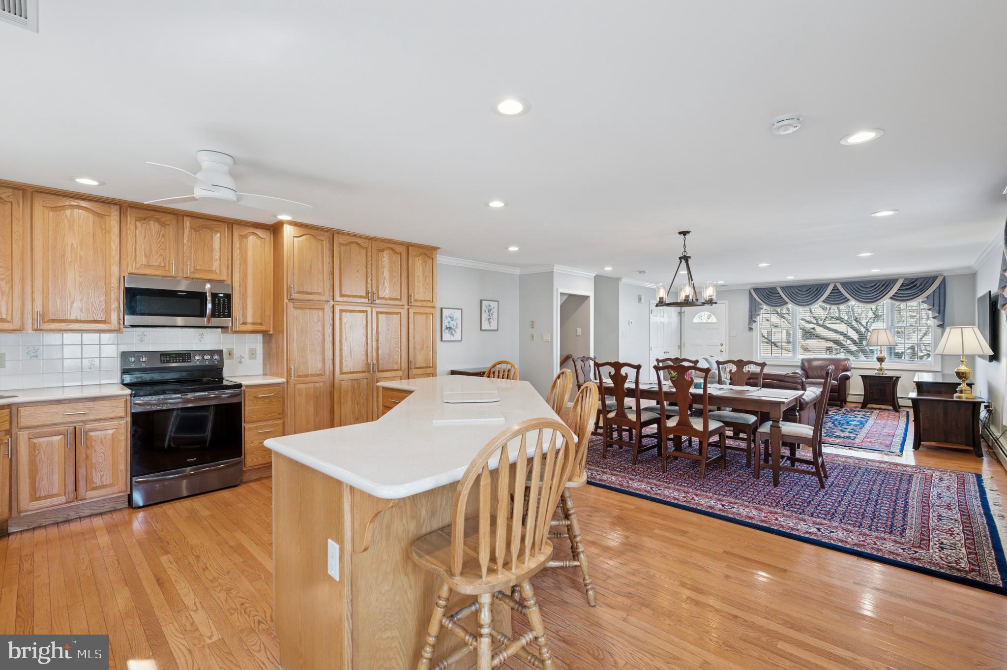 946 Georgetown Road Swarthmore, PA 19081 - Photo 13 of 36 a large kitchen with lots of furniture and stainless steel appliances