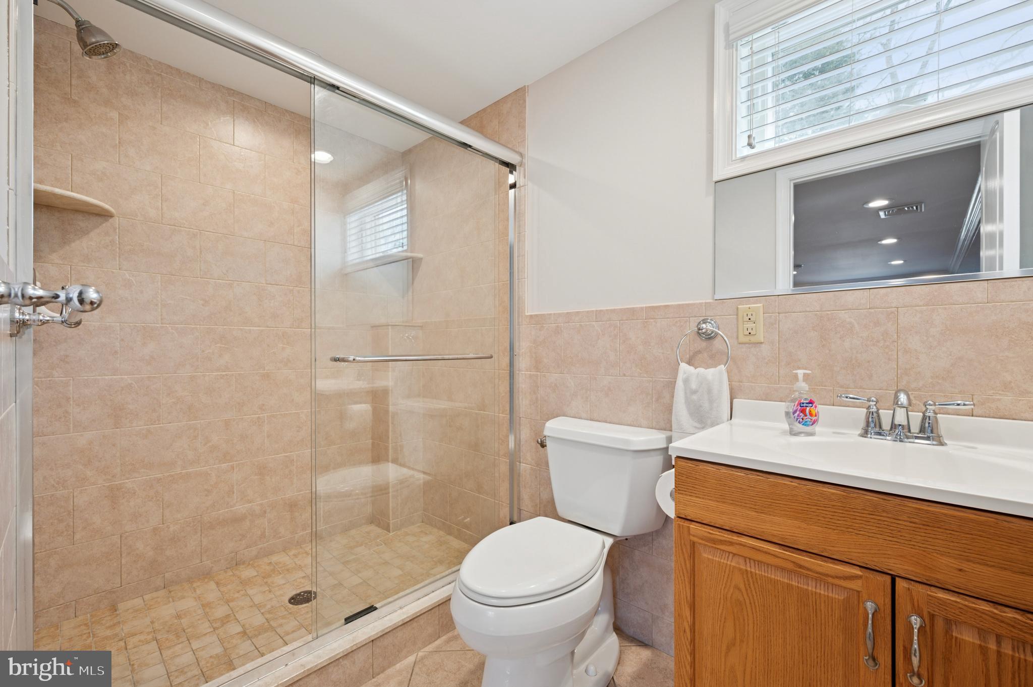 946 Georgetown Road Swarthmore, PA 19081 - Photo 20 of 36 a bathroom with a granite countertop sink toilet and shower