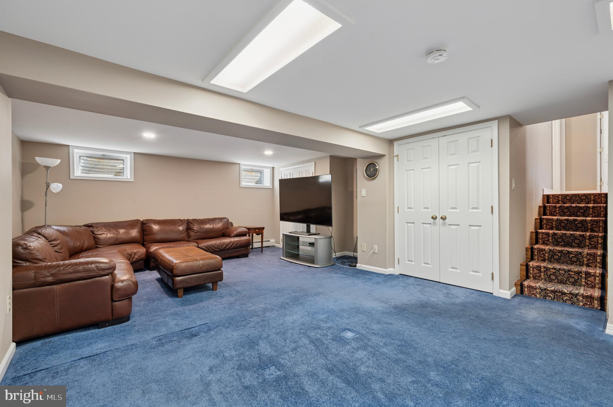 946 Georgetown Road Swarthmore, PA 19081 - Photo 22 of 36 a living room with furniture and a flat screen tv