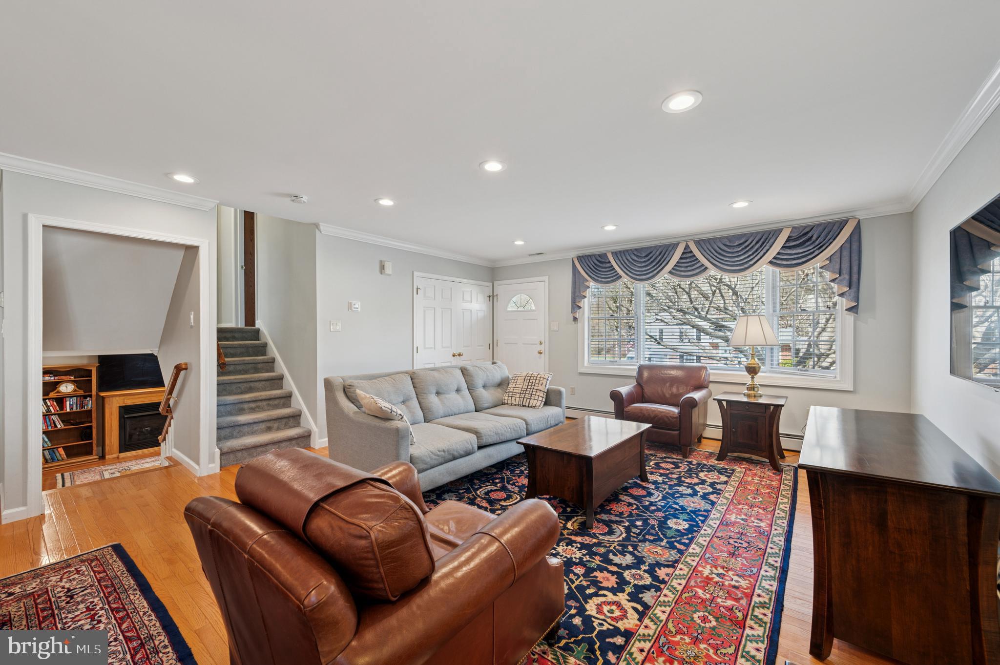946 Georgetown Road Swarthmore, PA 19081 - Photo 4 of 36 a living room with furniture and a fireplace