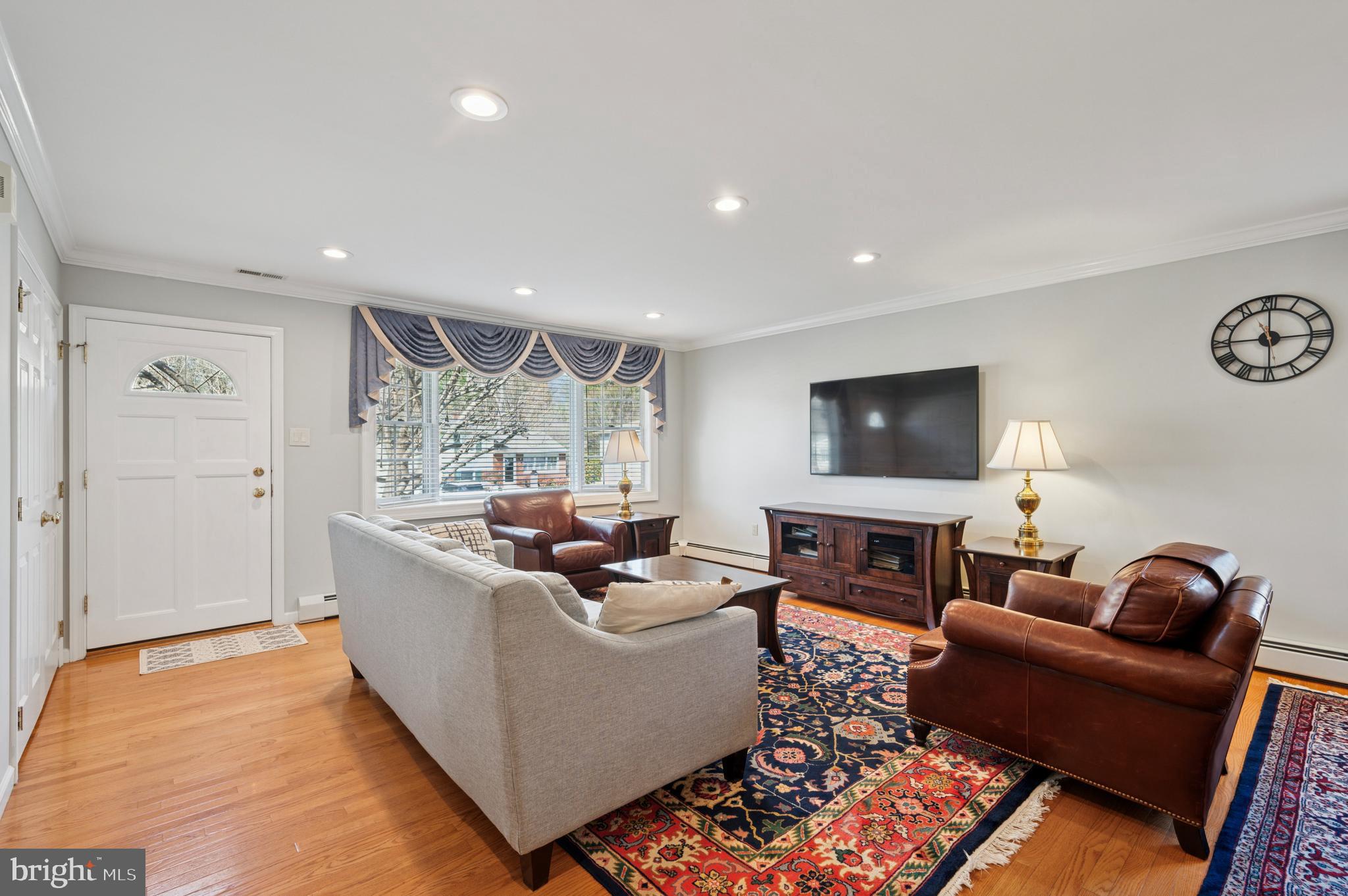 946 Georgetown Road Swarthmore, PA 19081 - Photo 5 of 36 a living room with furniture and a flat screen tv