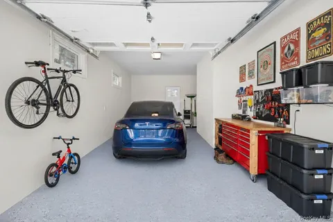 a bedroom with furniture a washer and a chandelier