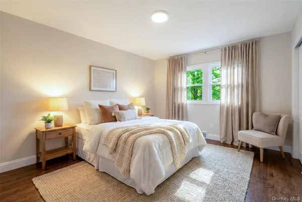 a bedroom with bed and a window