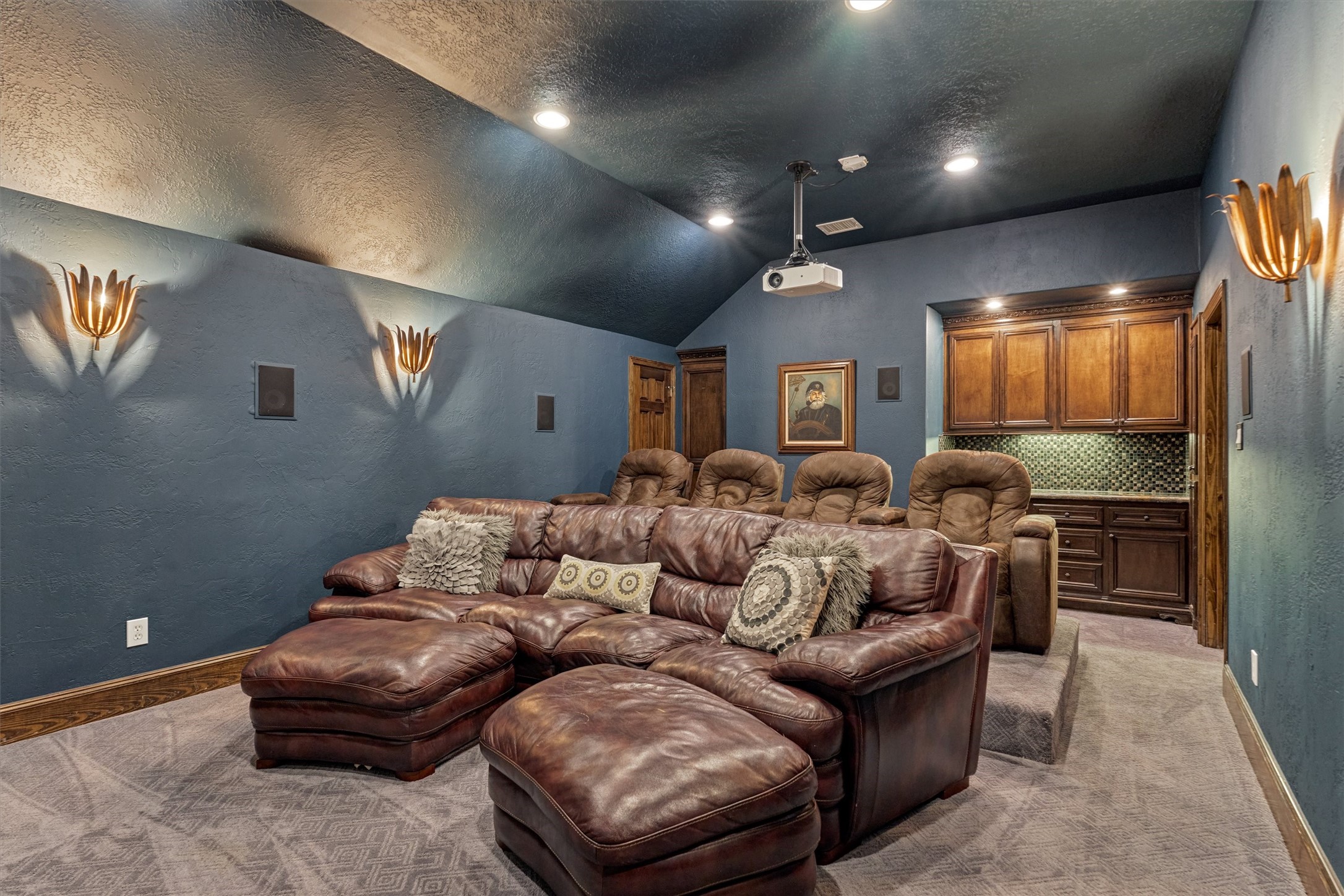 18 Treevine Court The Woodlands, TX 77381 - Photo 30 of 50 Enjoy stepped-up seating and a dry bar for the ultimate movie-watching experience.