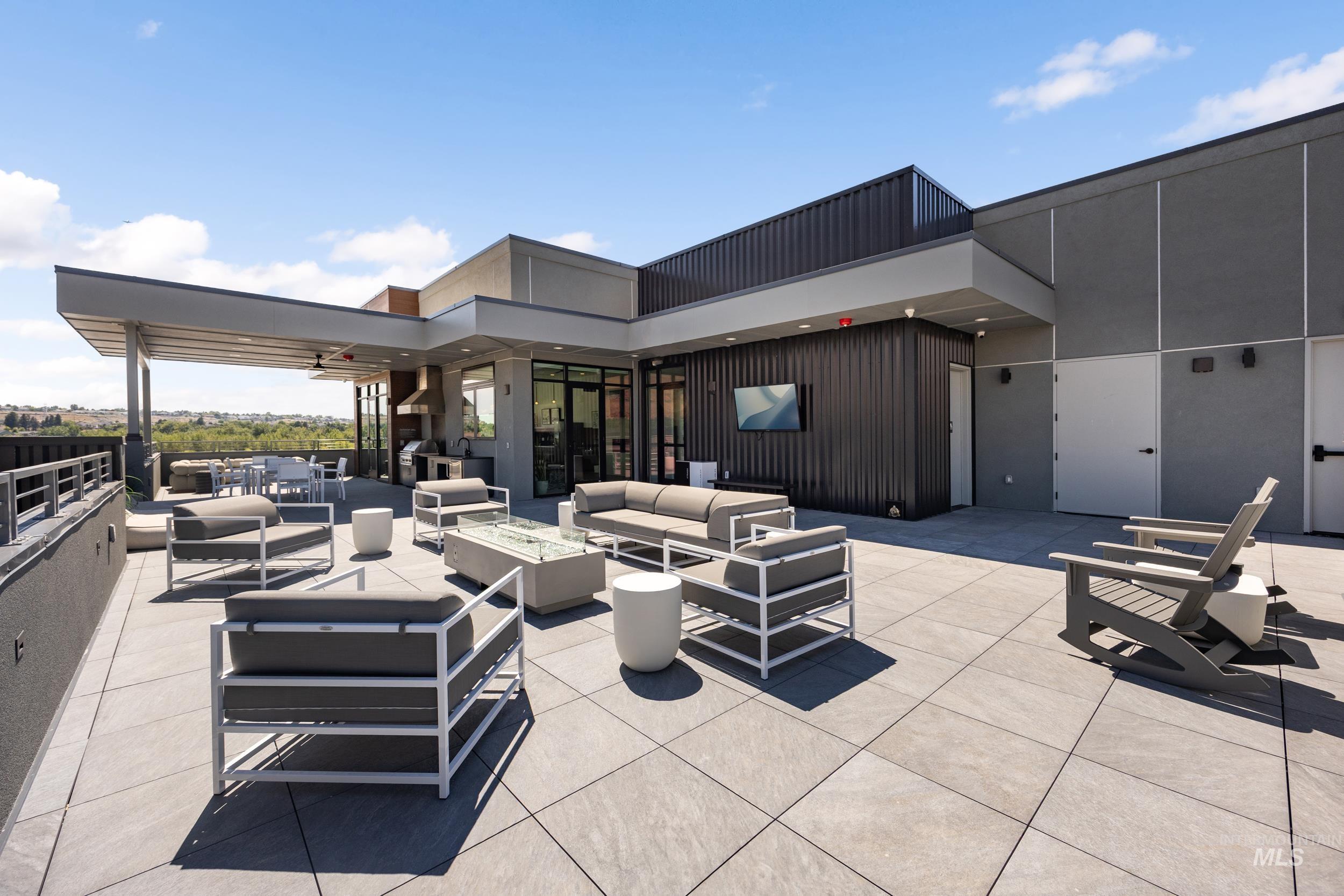 4340 East Haystack Street, Unit 307 Boise, ID 83716 - Photo 39 of 50 View of patio with an outdoor living space with a fire pit