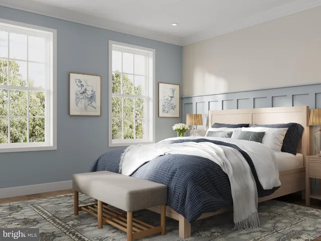 a bed room with a bed and a chair