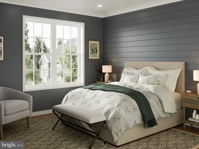 a bedroom with a bed and a couch