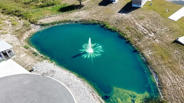 an aerial view of a house with a ocean view