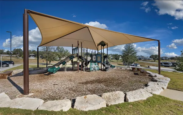 a swimming pool with outdoor seating and city view