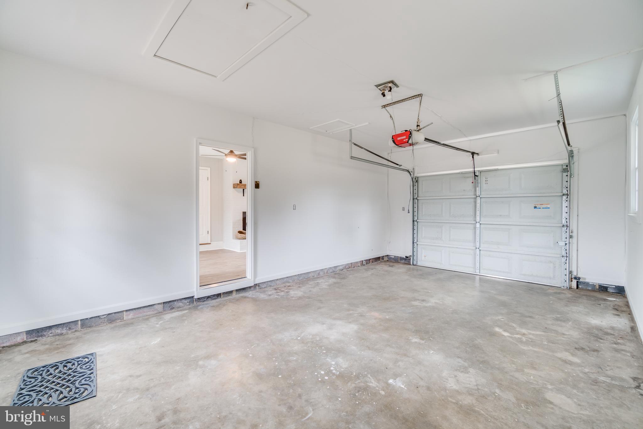 9035 Dahlgren Road King George, VA 22485 - Photo 30 of 38 Garage with door into the sitting room