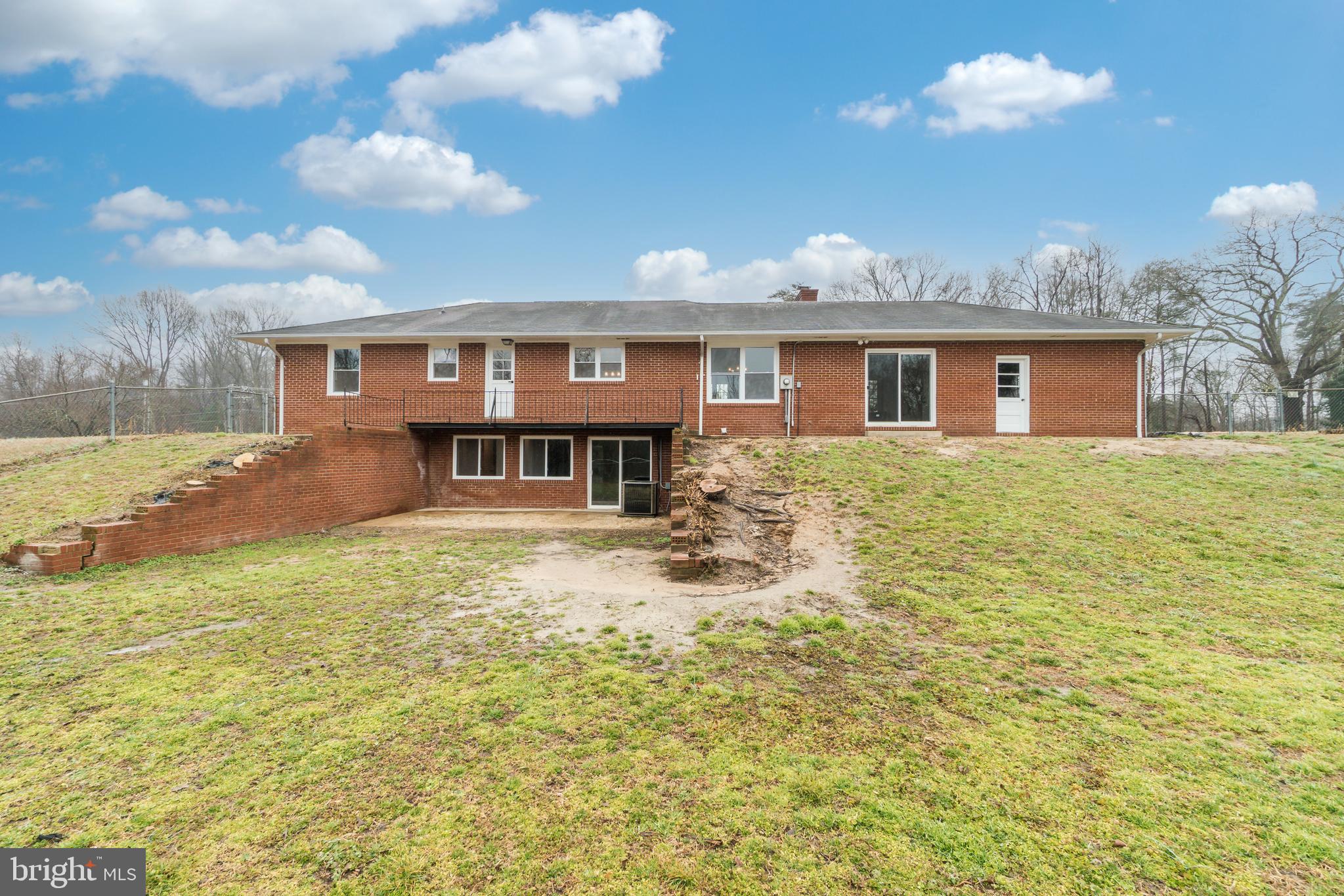 9035 Dahlgren Road King George, VA 22485 - Photo 36 of 38 Rear of home with basement entrance