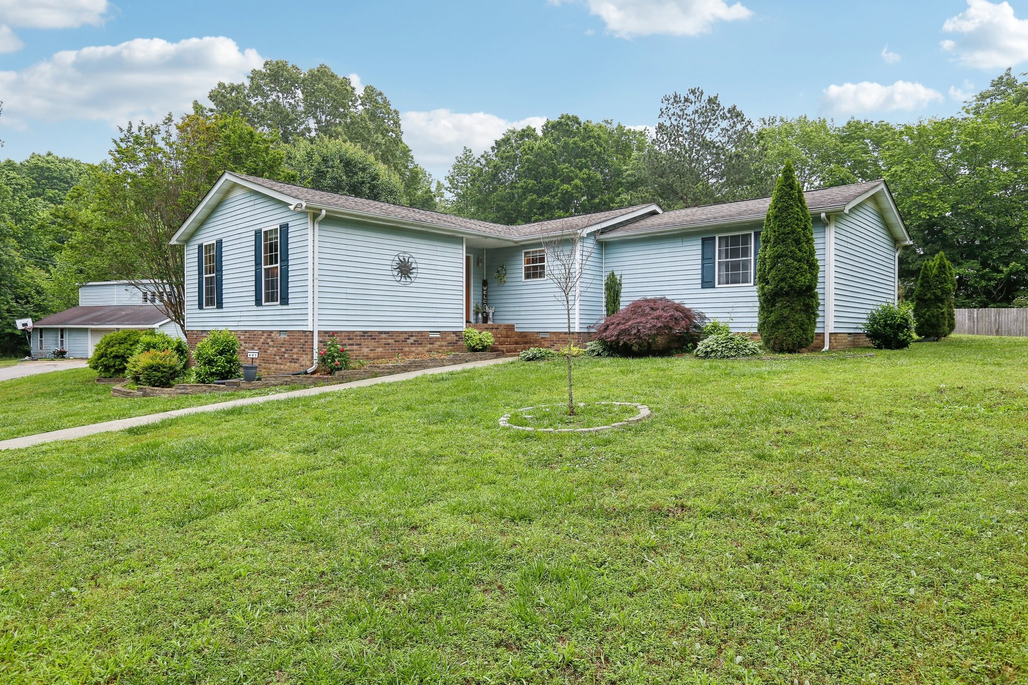 401 Harper Road Clarksville, TN 37043 - Photo 6 of 79 a view of a house with a yard and plants