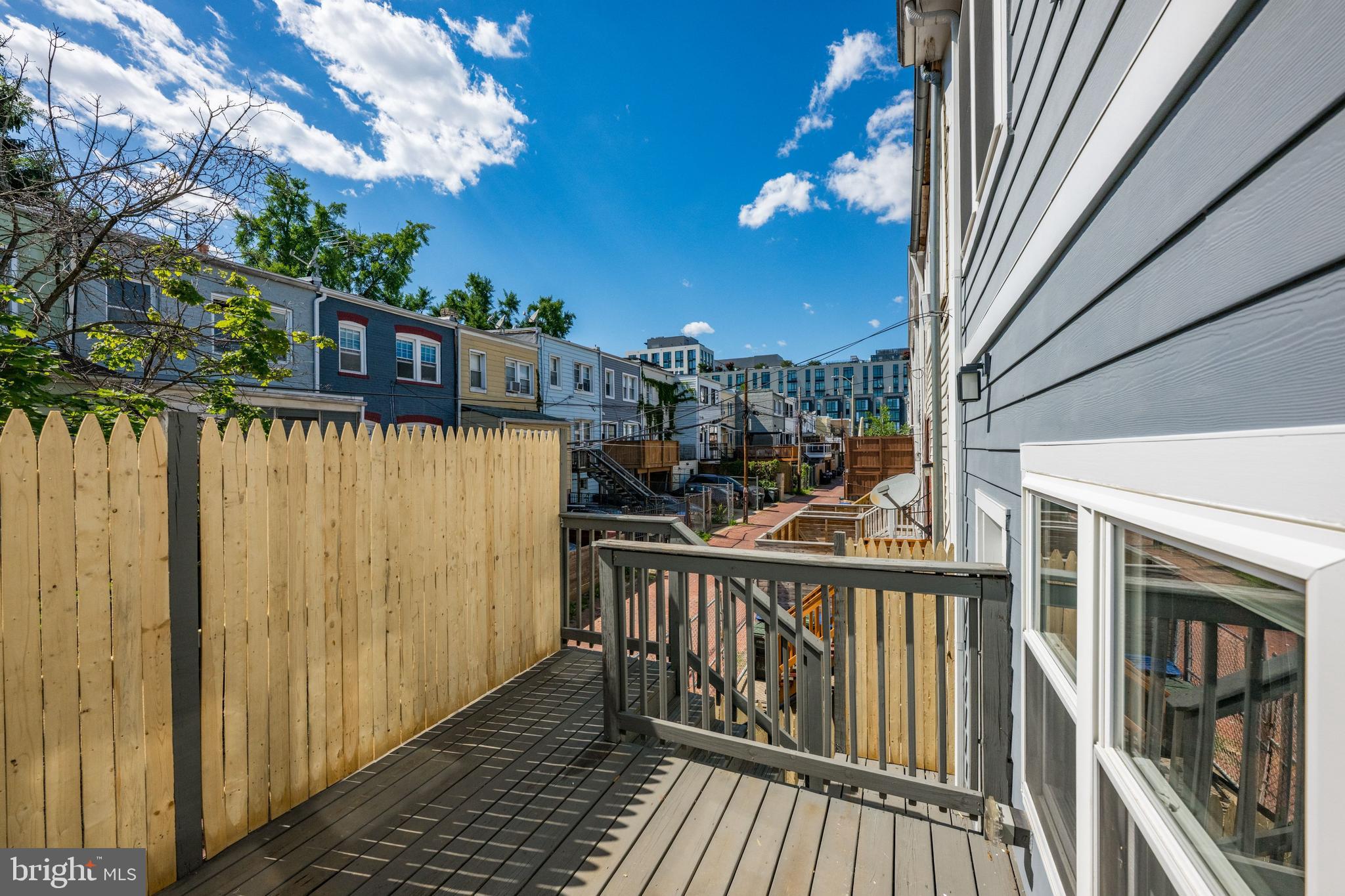 1124 4th Street Northeast Washington, DC 20002 - Photo 29 of 34 a view of a balcony with wooden floor and fence