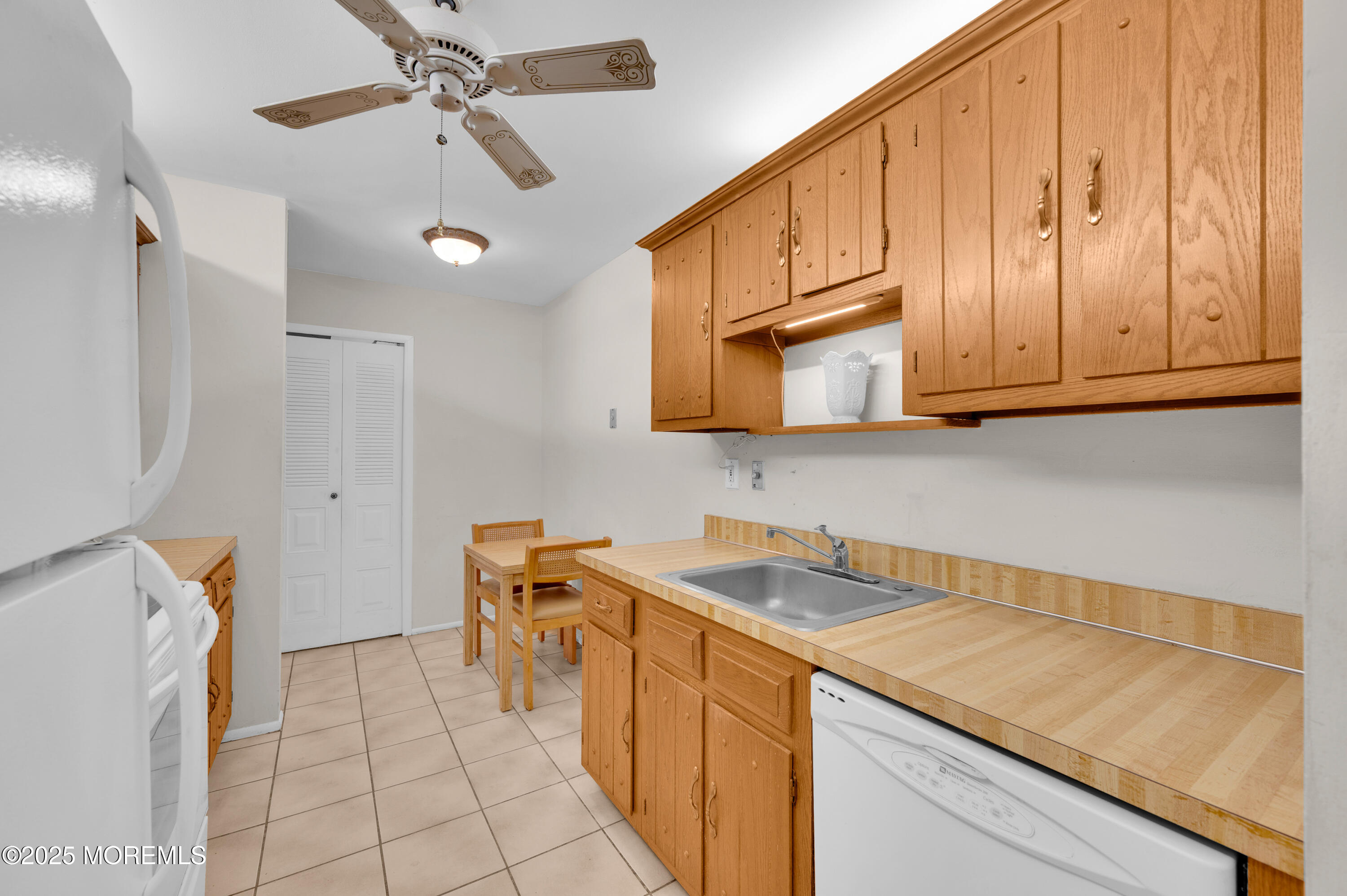 97 Arrowood Road, Unit A Englishtown, NJ 07726 - Photo 14 of 28 a utility room with stainless steel appliances granite countertop a sink and a cabinets