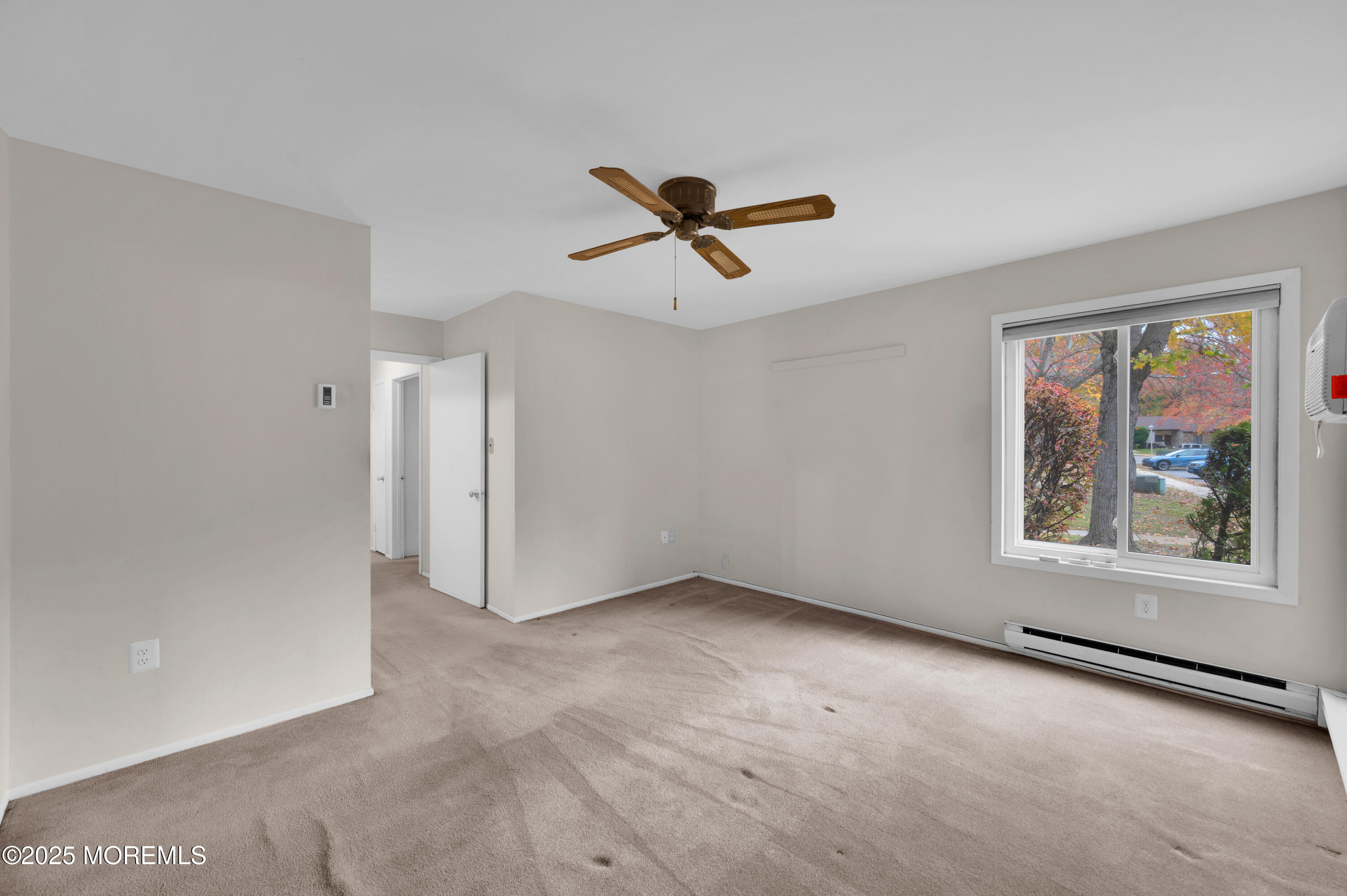 97 Arrowood Road, Unit A Englishtown, NJ 07726 - Photo 23 of 28 wooden floor in an empty room with a window