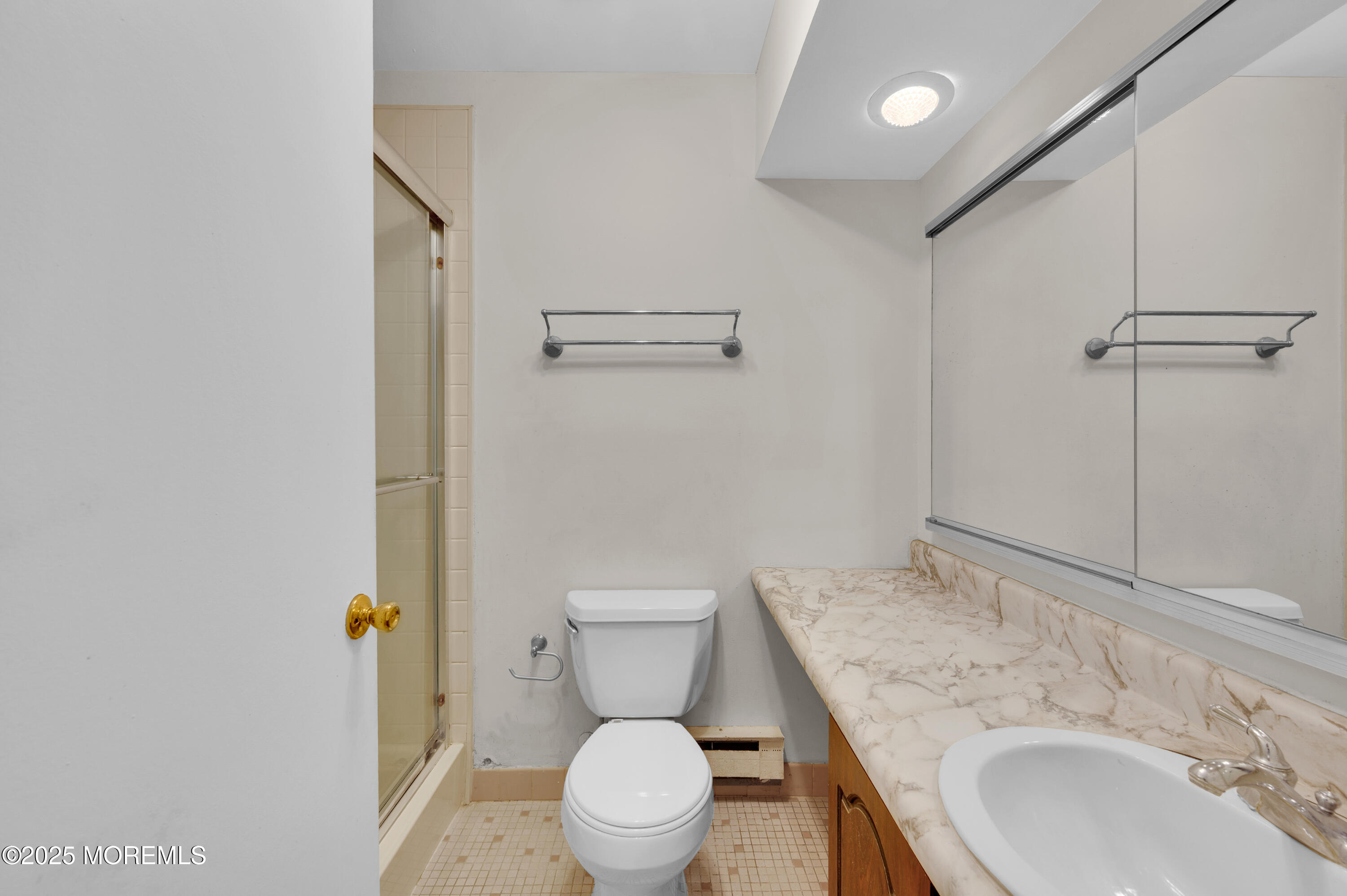 97 Arrowood Road, Unit A Englishtown, NJ 07726 - Photo 25 of 28 a bathroom with a sink toilet and shower