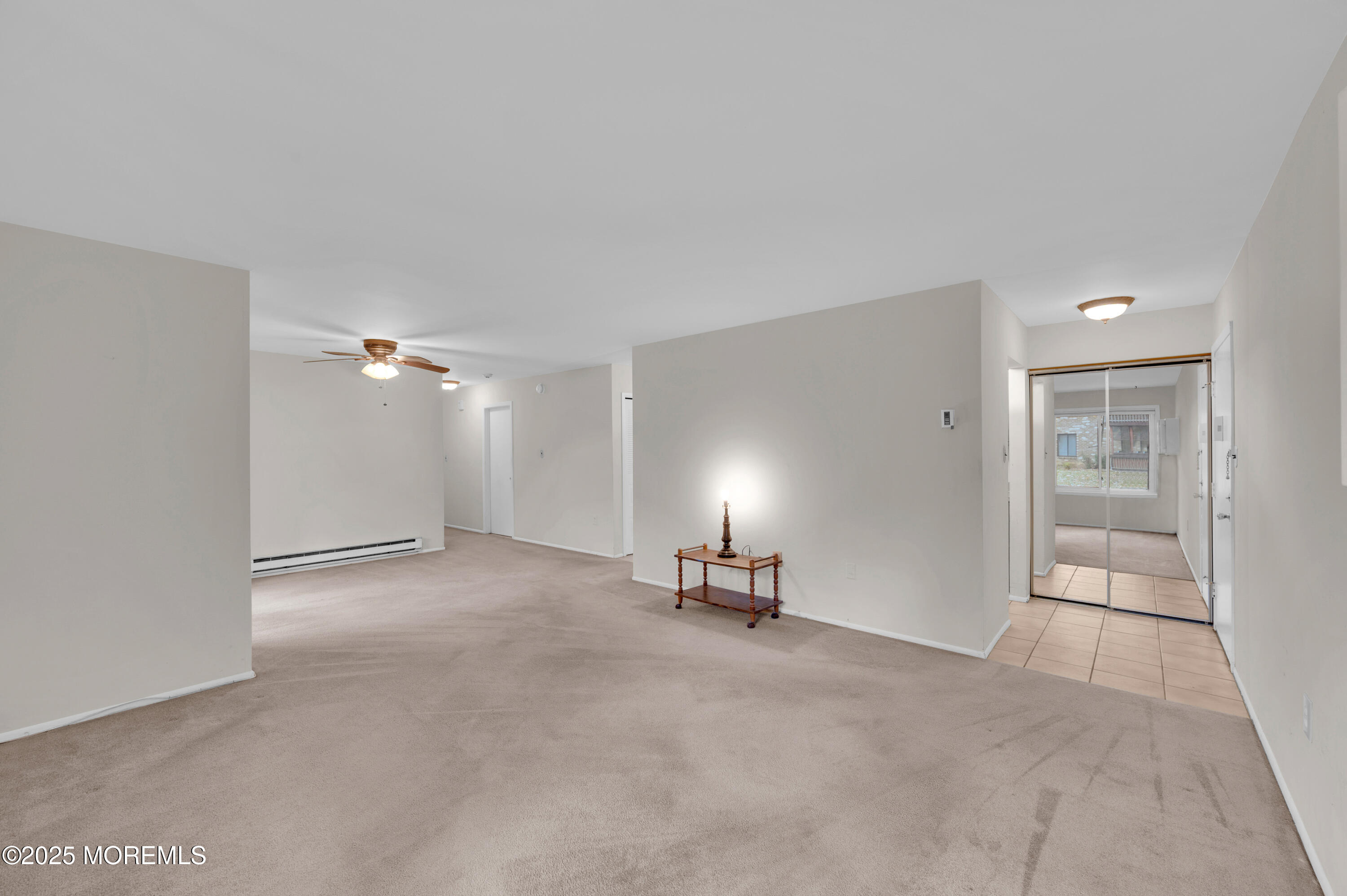 97 Arrowood Road, Unit A Englishtown, NJ 07726 - Photo 7 of 28 a view of a livingroom with a chair and a fireplace