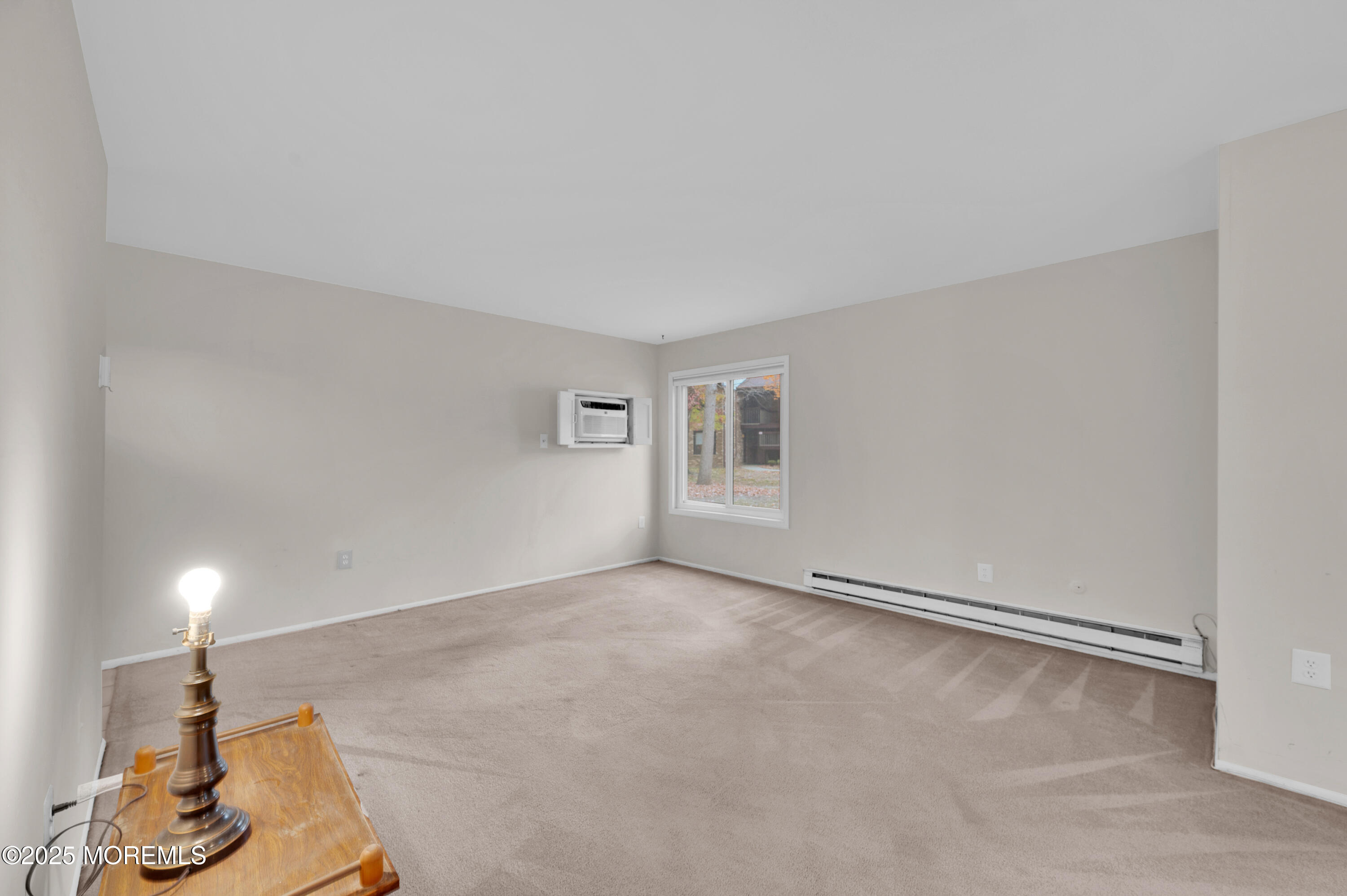 97 Arrowood Road, Unit A Englishtown, NJ 07726 - Photo 8 of 28 a view of an empty room with windows