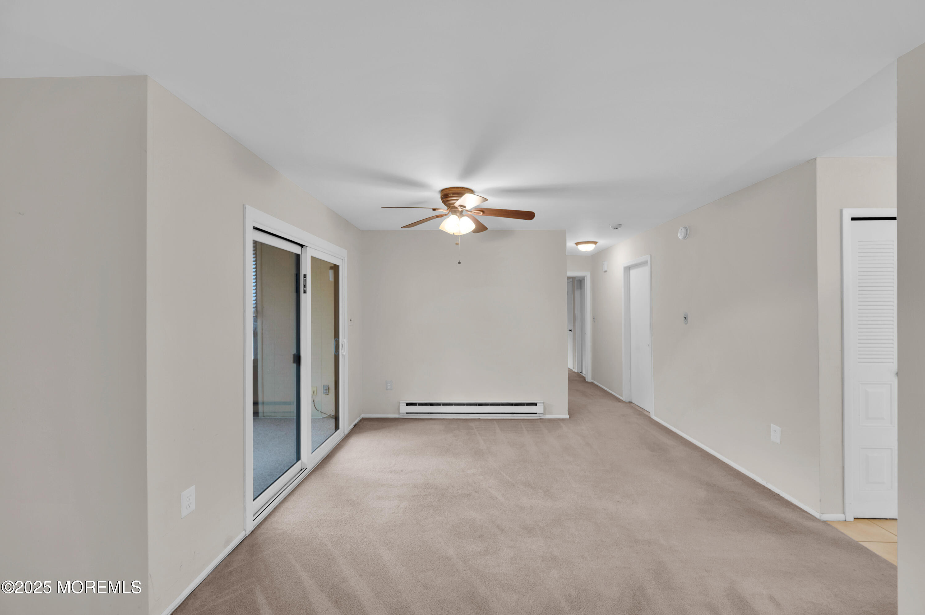 97 Arrowood Road, Unit A Englishtown, NJ 07726 - Photo 9 of 28 a view of a livingroom with a ceiling fan