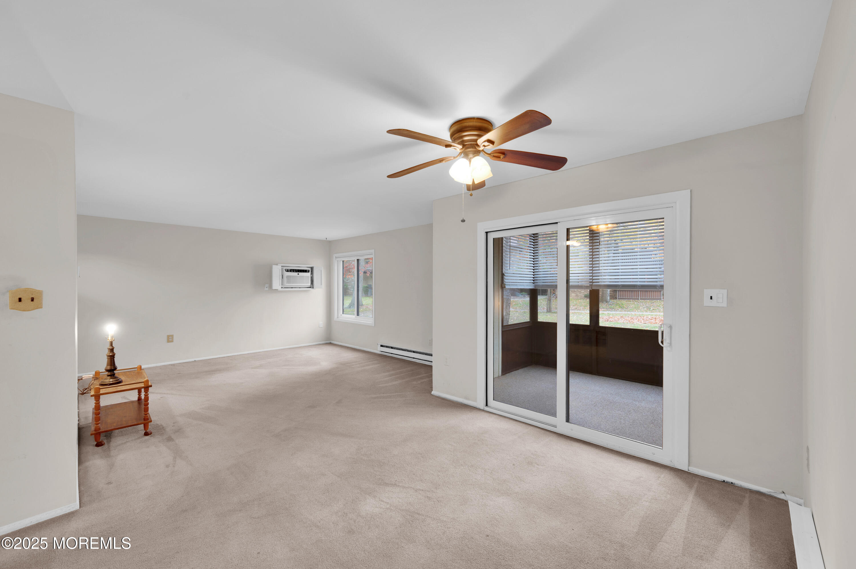97 Arrowood Road, Unit A Englishtown, NJ 07726 - Photo 10 of 28 a view of an empty room with a ceiling fan