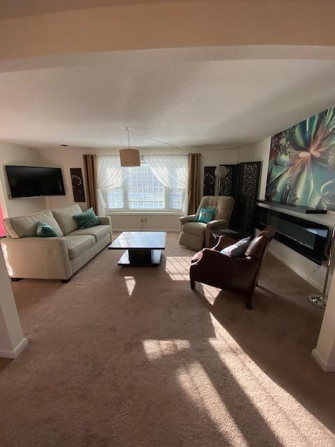 5 Barbary Circle Mashpee, MA 02649 - Photo 15 of 24 a living room with furniture and a flat screen tv