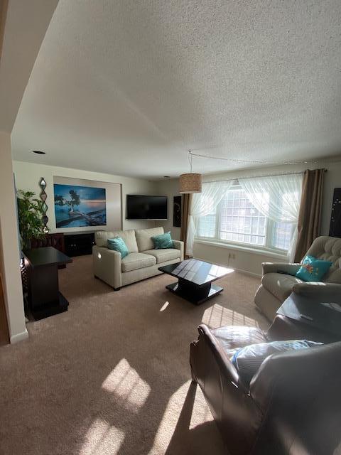 5 Barbary Circle Mashpee, MA 02649 - Photo 16 of 24 a living room with furniture and a large window