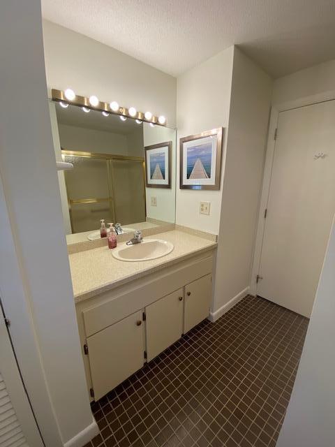 5 Barbary Circle Mashpee, MA 02649 - Photo 20 of 24 a bathroom with a sink and a mirror