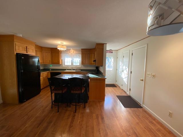 5 Barbary Circle Mashpee, MA 02649 - Photo 9 of 24 a kitchen with a refrigerator and a sink