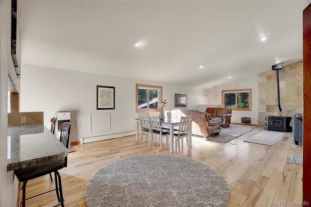 a view of a livingroom with furniture and a table