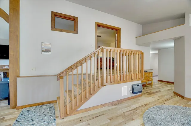 a view of entryway with wooden floor