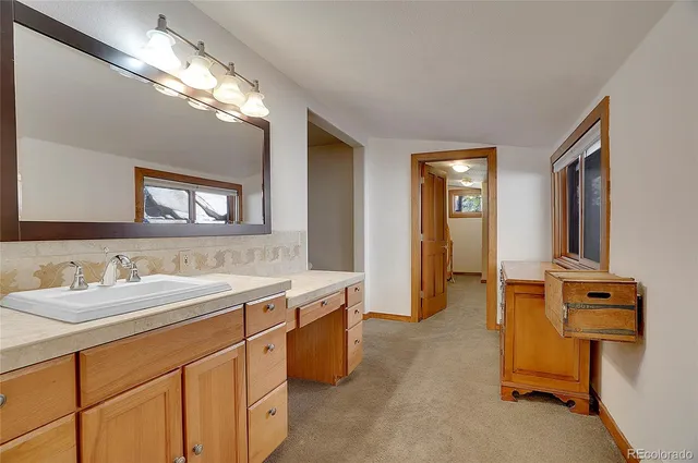 a spacious bathroom with a double vanity sink mirror and
