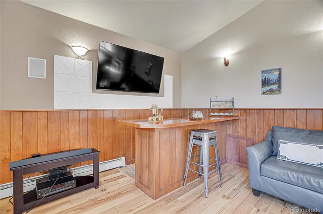 a living room with a couch and a flat screen tv