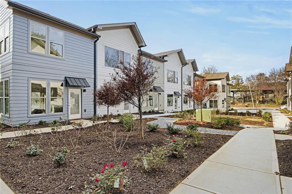 1070 Dill Avenue Southwest, Unit 201 Atlanta, GA 30310 - Photo 15 of 17 a row of car parked in front of a house