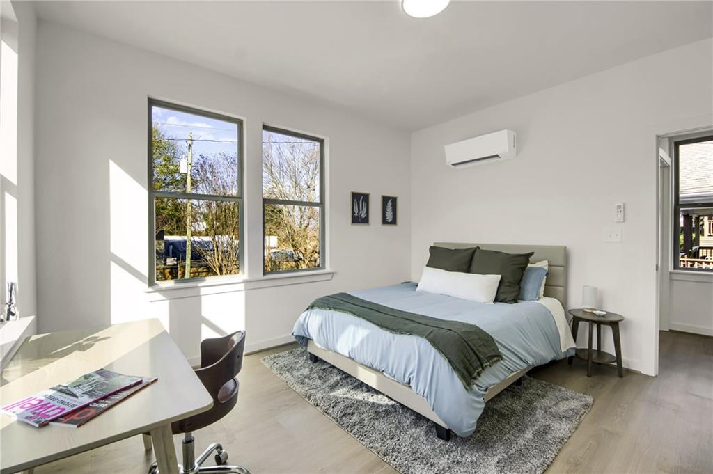 1070 Dill Avenue Southwest, Unit 201 Atlanta, GA 30310 - Photo 10 of 17 a bedroom with a bed and a window