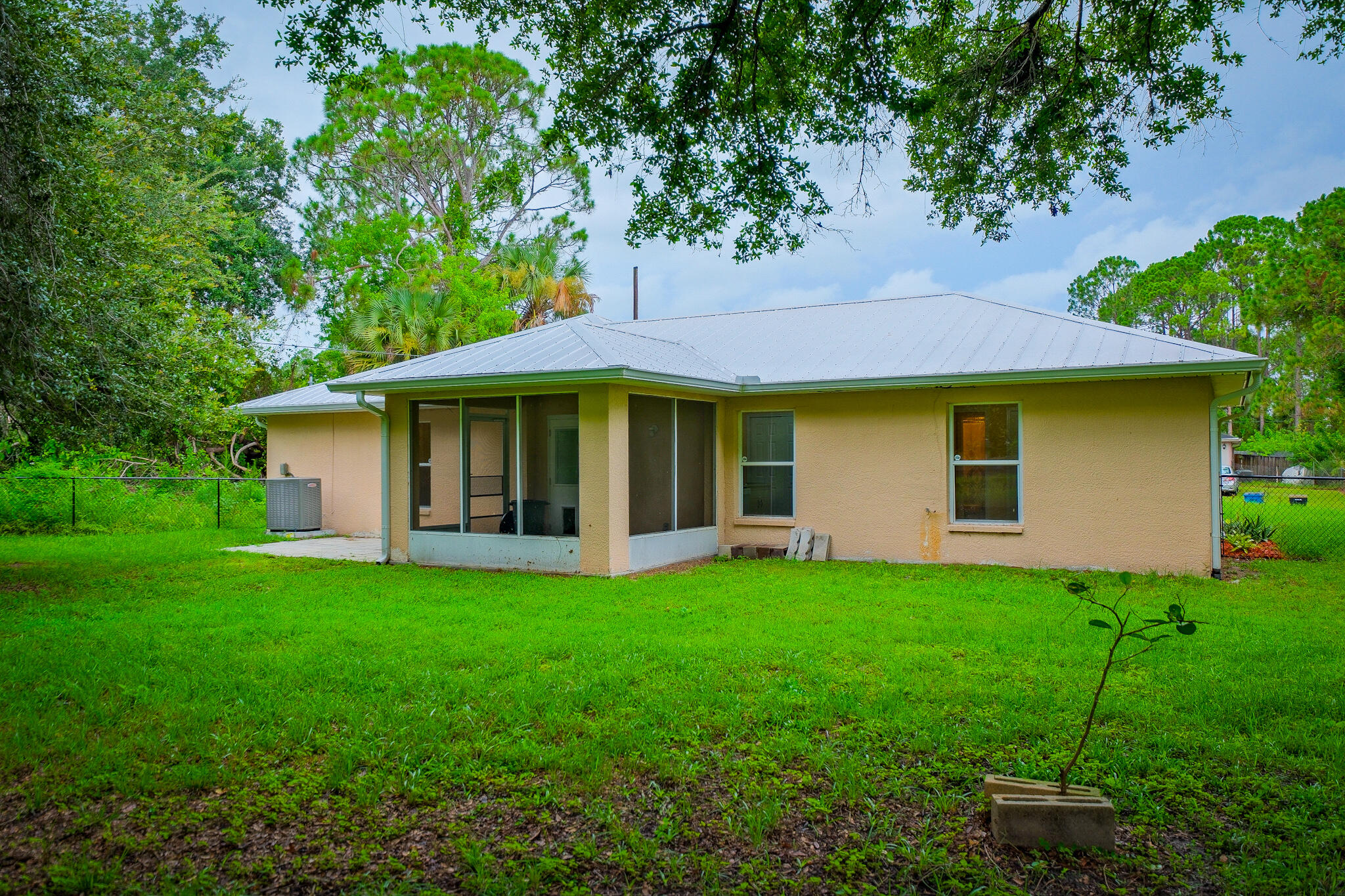 762 Gerlitz Road Southwest Palm Bay, FL 32908 - Photo 25 of 29 a view of a house with a yard and tree s