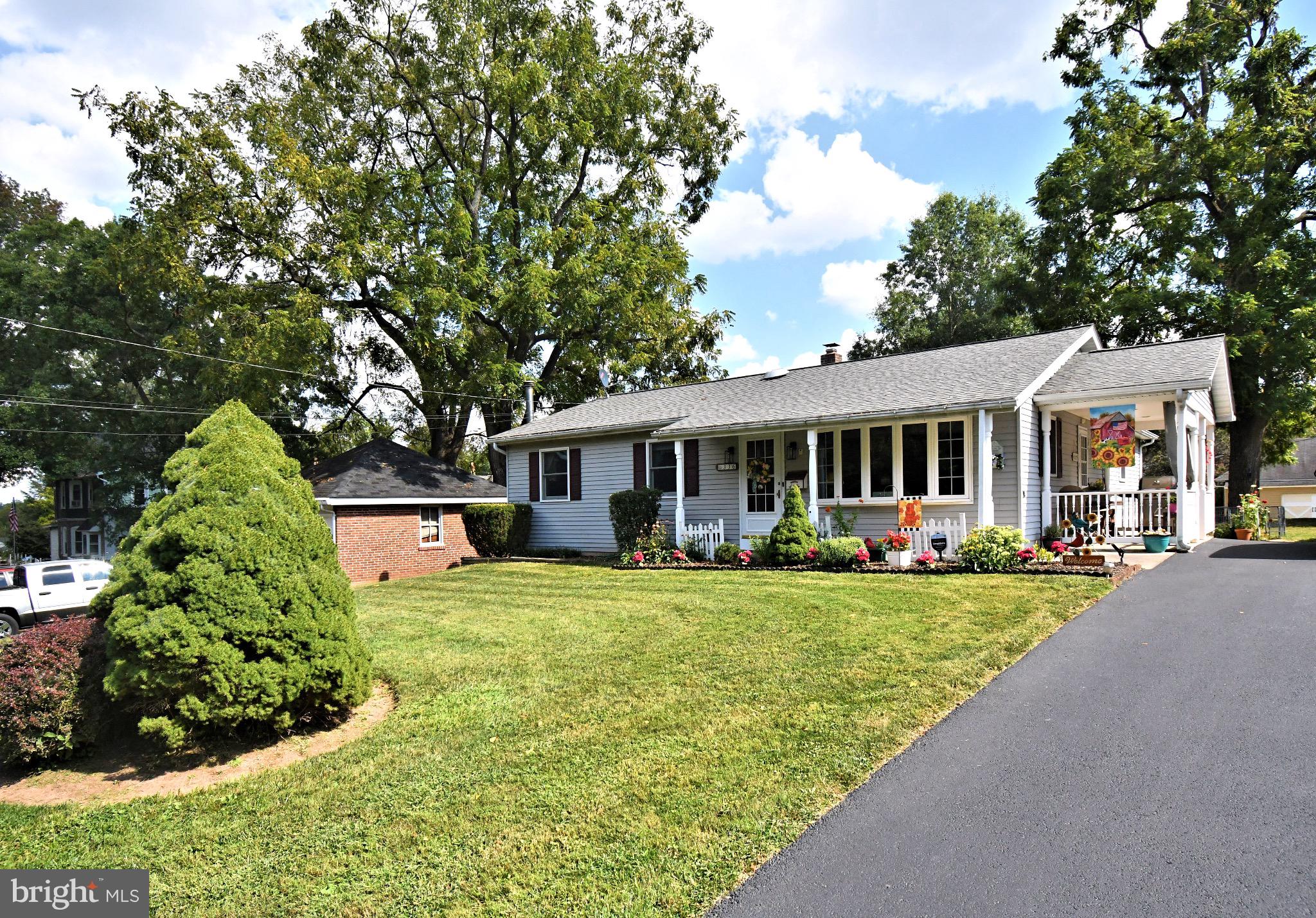 336 Arch Street Spring City, PA 19475 - Photo 2 of 58 a front view of a house with a garden and trees