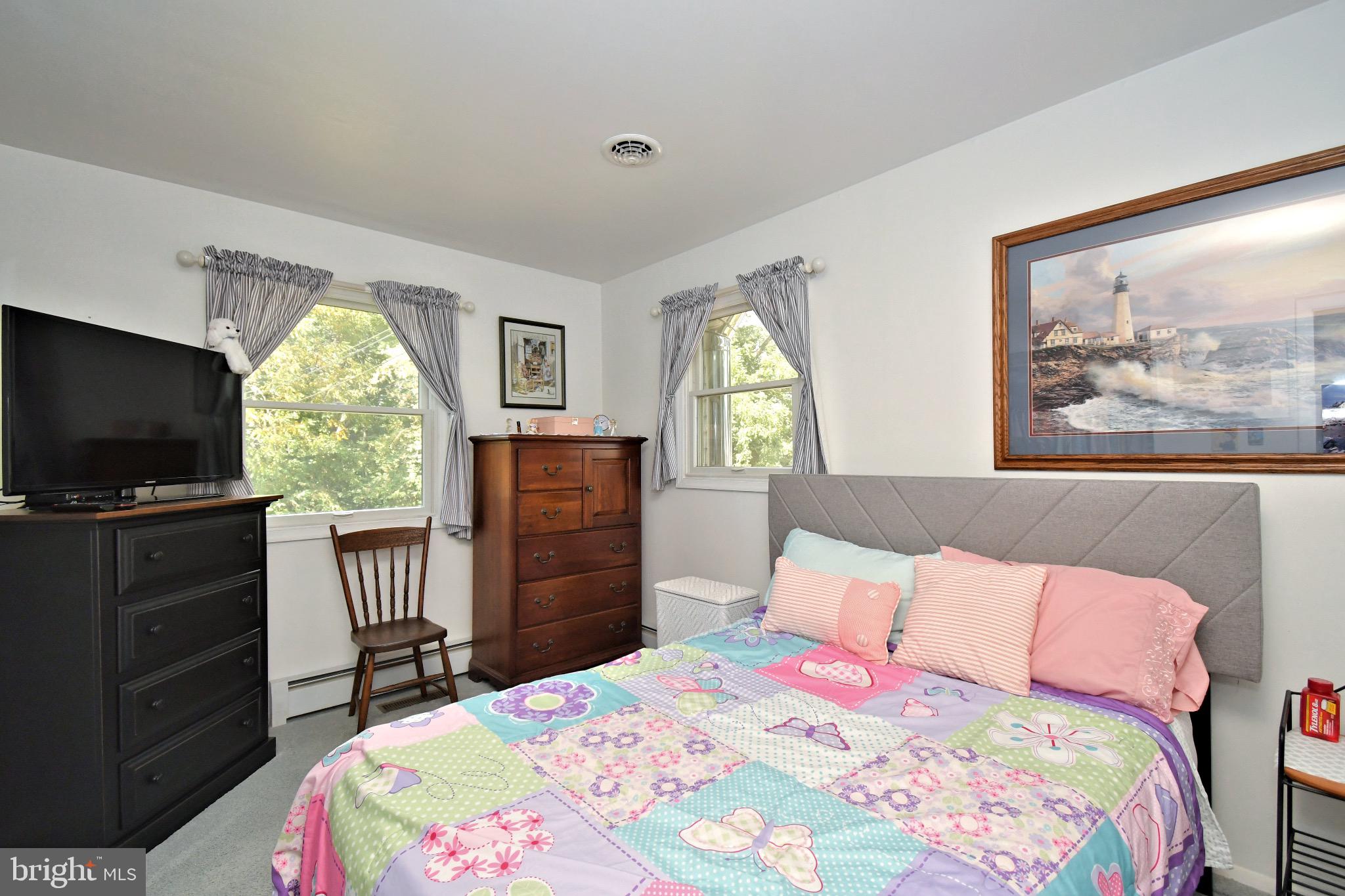 336 Arch Street Spring City, PA 19475 - Photo 26 of 58 a bedroom with a bed and a flat screen tv