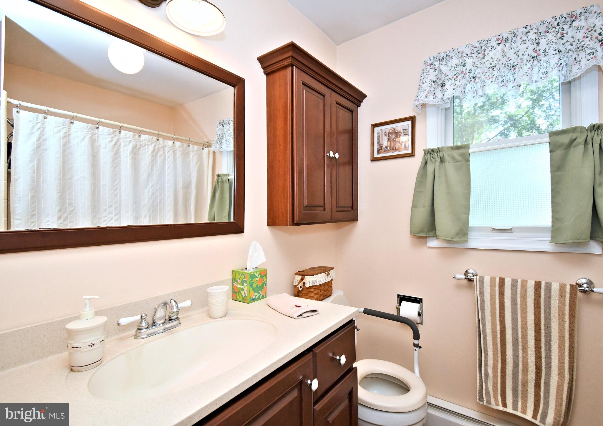 336 Arch Street Spring City, PA 19475 - Photo 32 of 58 a bathroom with a granite countertop sink vanity mirror and toilet