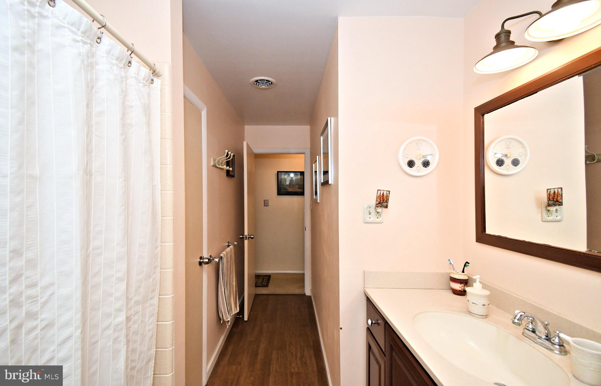 336 Arch Street Spring City, PA 19475 - Photo 33 of 58 a bathroom with a sink a mirror and a shower
