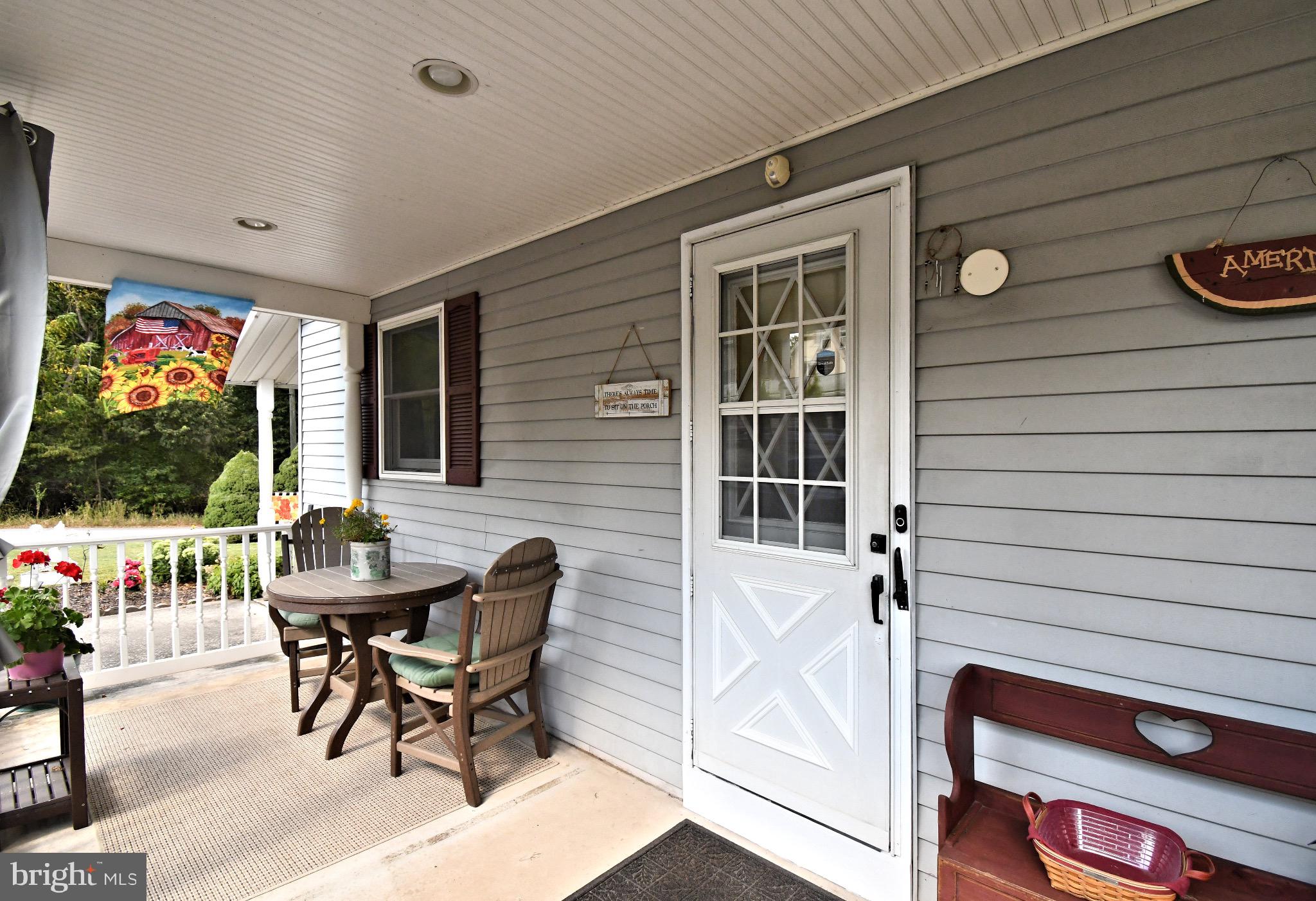 336 Arch Street Spring City, PA 19475 - Photo 45 of 58 a patio with table and chairs and potted plants