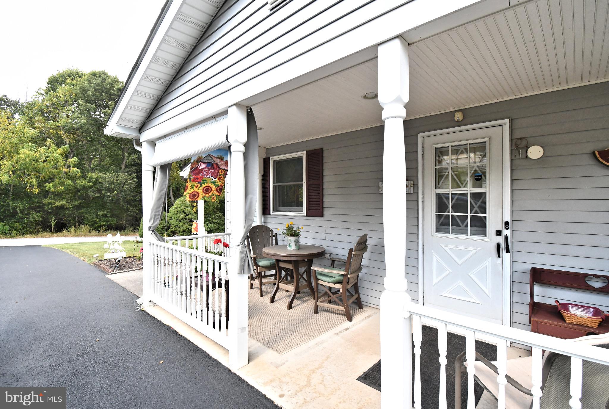 336 Arch Street Spring City, PA 19475 - Photo 46 of 58 a view of a patio with a table and chairs and potted plants